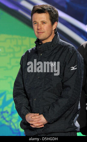 The Medal Presenter, His Royal Highness Crown Prince Frederik of Denmark, Member of the IOC, stands on the podium during the medal ceremony for the Men's Biathlon 10 km Sprint at Whistler Medal Plaza during the Vancouver 2010 Olympic Games, Whistler, Canada, 14 February 2010. Photo: Martin Schutt Stock Photo