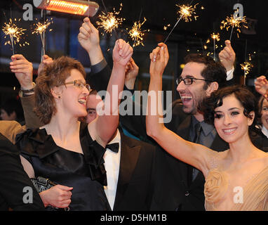 Director Jasmila Zbanic (L), Croatian actress Zrinka Cvitesic (R) and actor Ermin Bravo (C) arrive for the premiere of the film 'On the Path' running in the competition during the 60th Berlinale International Film Festival in Berlin, Germany, Thursday, 18 February 2010. The festival runs until 21 Febuary 2010. Photo: Jens Kalaene dpa/lbn Stock Photo