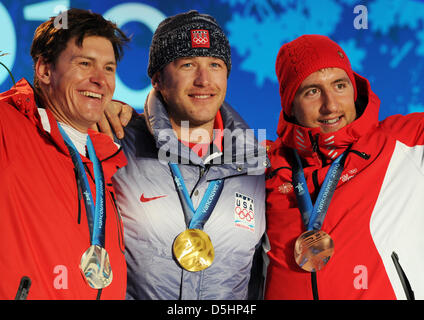 Men's Super Combined gold medal winner Bode Miller (C) of the USA and silver medalist Ivica Kostelic (L) of Croatia and bronze medalist Silvan Zurbriggen of Switzerland during the medal ceremony at Whistler Medal Plaza during the Vancouver 2010 Olympic Games, Whistler, Canada, 21 February 2010. Photo: Martin Schutt  +++(c) dpa - Bildfunk+++ Stock Photo