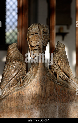 15th century poppy head finials on a pew end at St Giles Church, Holme, Newark, Nottinghamshire Stock Photo