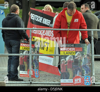 Supporters of the right-wing extremist NPD demonstrate in front of the Thuringian state parliament in Erfurt, Germany, 20 September 2012. They accused the members of parliament to share responsibility for the decrease in population and demanded the renunciation of the Euro. Photo: MARTIN SCHUTT Stock Photo