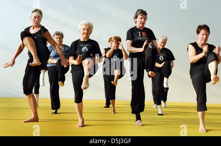 86-year-old Johanna Quaas (3-l), the world's oldest gymnast, is pictured during a Aroha fitness class, a sport which is inspired by ancient war dances of the Maoris, in Halle, Germany, 06 November 2012. The agile gymnast, whose birthday is on 20 November, does sport acitivities every day and still participates in competitions. As the oldest active gymnast, she is listed in the Guin Stock Photo