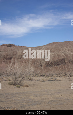 Desert mountain with blue skies and random clouds Stock Photo - Alamy