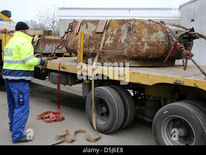 Remnants of a Soviet tank, that were found during construction works in November 2011 and that were storaged by a weapons and ammunition disposal service, are loaded to a location in Rostock, Germany, 16 November 2012. After disposing a granade within the tank, the Soviet T34 tank, that was probably destroyed on 01 May 1945 during the demolition of a bridge, shall be presented in a Stock Photo