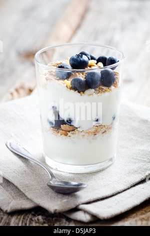 Natural yogurt with fresh blueberries, selective focus Stock Photo