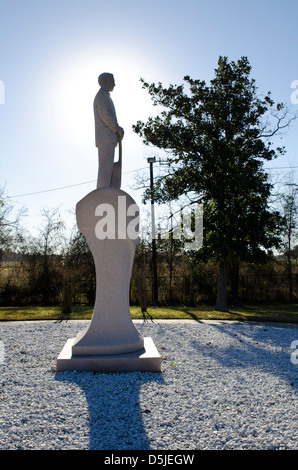 Statue of Jim Reeves backlit by the sun located in the Jim Reeves Memorial Park just outside Carthage, Texas, USA Stock Photo