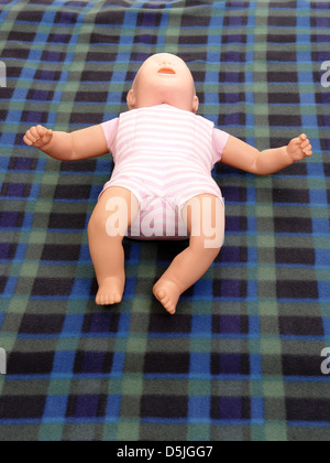 Infant dummy used for child first aid resuscitation technique demonstration Stock Photo