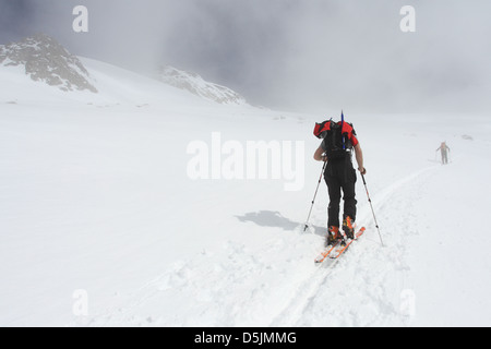 Mountaineers on a ski trail leading to Grosser Geiger, Venedigergruppe, Osttirol, Austria. Stock Photo