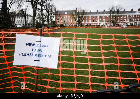 Sign on a newly laid lawn asking people to keep off. Stock Photo