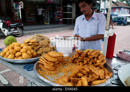 A Malaysian street vendor selling popular local snacks Stock Photo