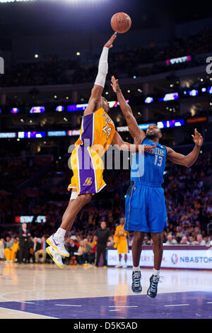 Los Angeles, California, USA. 2nd April 2013. Guard (24) Kobe Bryant of the Los Angeles Lakers shoots a sky hook over (13) Mike James of the Dallas Mavericks during the second half of the Lakers 101-81 victory over the Mavericks at the STAPLES Center in Los Angeles, CA. Credit: Action Plus Sports Images / Alamy Live News Stock Photo