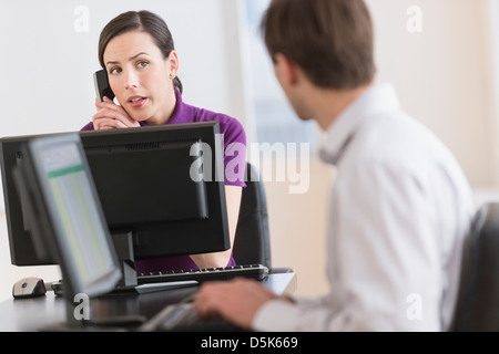 Office workers using computers Stock Photo