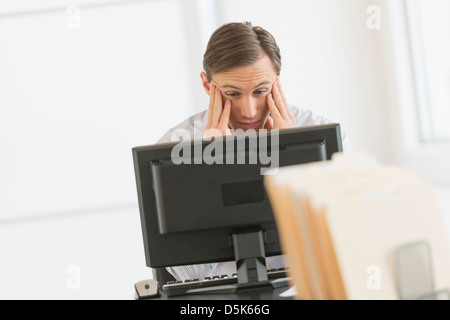 Office worker using computer Stock Photo