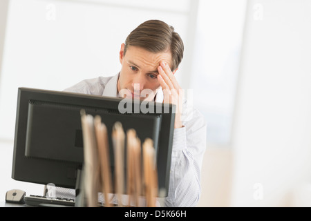Office worker using computer Stock Photo