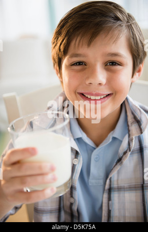 Boy (8-9) drinking milk Stock Photo