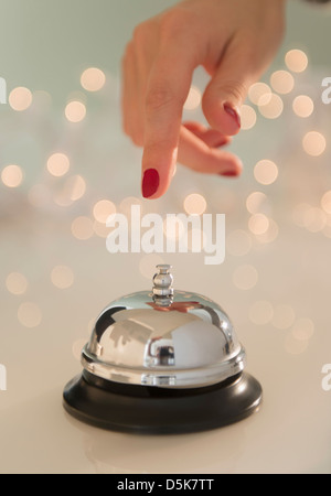 Hand and service bell Stock Photo