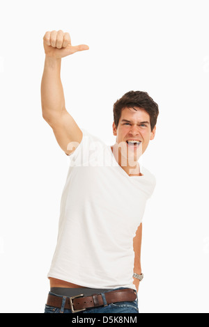 Studio portrait of handsome man cheering Stock Photo