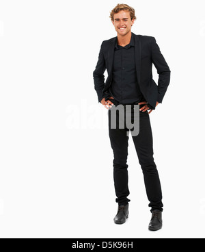 Studio Shot of young man with hands on hips Stock Photo