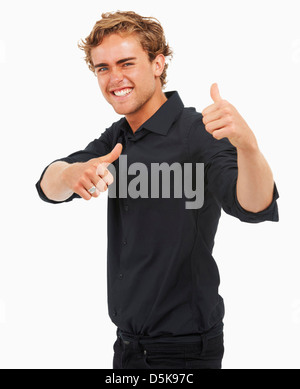 Studio Shot, Portrait of young man with thumbs up Stock Photo
