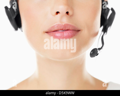 Close-up of woman wearing headset Stock Photo