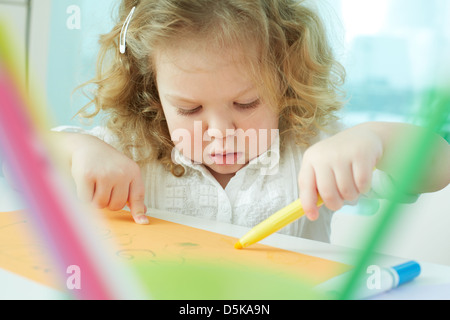 Curly beauty learning how to draw Stock Photo