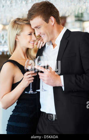 Couple drinking wine in restaurant Stock Photo