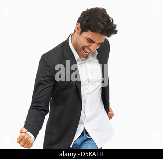 Studio portrait of stylish man cheering Stock Photo