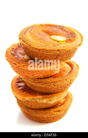 Cakes on a pile isolated over white Stock Photo