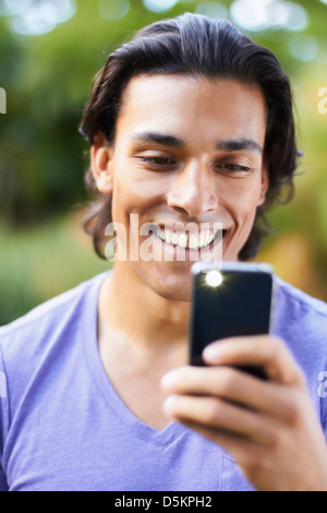 Portrait of young man using mobile phone Stock Photo