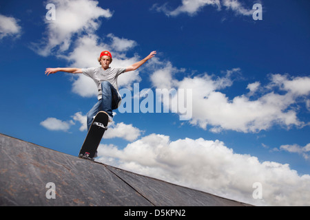 Young man on skateboard jumping Stock Photo