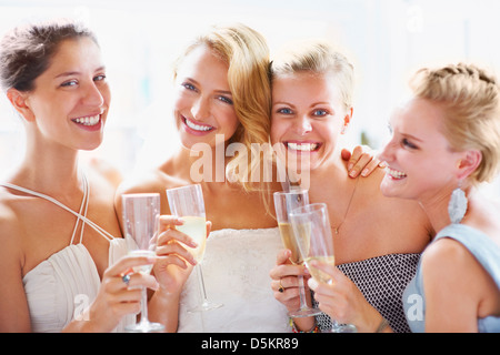 Bride and bridesmaids toasting Stock Photo