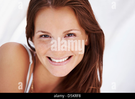 Studio portrait of woman smiling Stock Photo