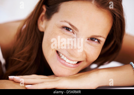 Studio portrait of woman smiling Stock Photo