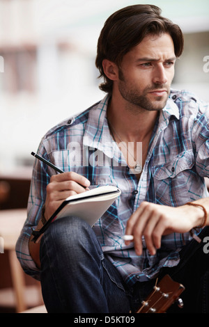 Man doing notes Stock Photo
