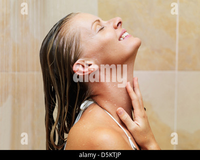 Mid adult woman in spa shower Stock Photo