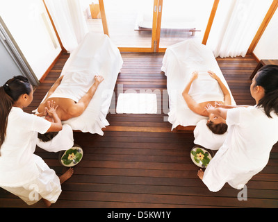 Couple getting massage in spa Stock Photo