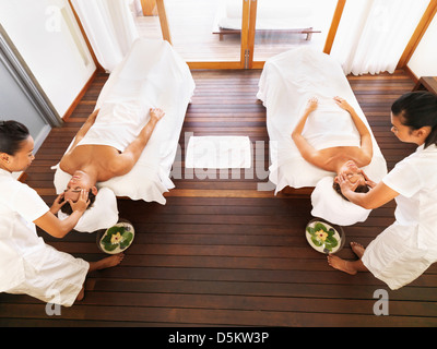 Couple getting massage in spa Stock Photo