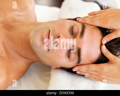 Man receiving massage in spa Stock Photo