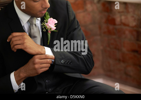 Bridegroom adjusting cuff Stock Photo