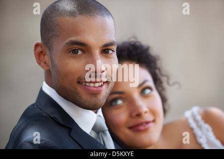 Portrait of newly wed couple, focus on groom Stock Photo
