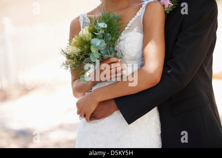 Newlywed couple embracing Stock Photo
