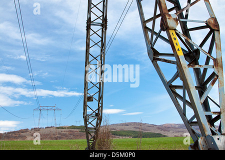 High voltage towers, under the blue sky white clouds at february Stock ...