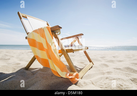 Sun chair on sandy beach Stock Photo