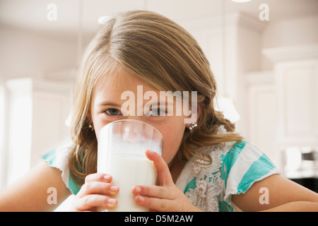 Girl (6-7) drinking milk Stock Photo