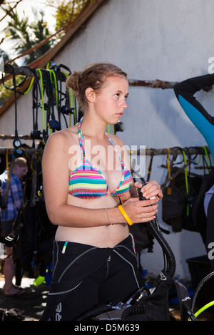 Madagascar, Nosy Be, Marodokana, Operation Wallacea scuba diving student listening to instructor Stock Photo