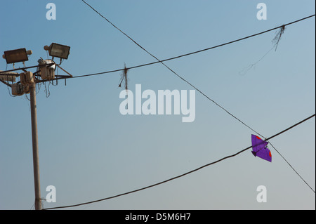 Kites caught on overhead power lines. Varanasi, India. Stock Photo