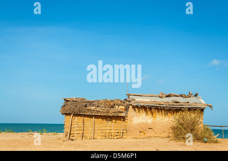 A mud house, typical housing of Wayuu Indians in La Guajira, Colombia on a beach Stock Photo