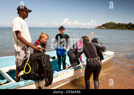Madagascar, Nosy Be, Marodokana, Operation Wallacea students boarding dive boat Stock Photo