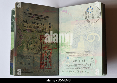 Fully stamped Visa pages in a Passport. Stock Photo