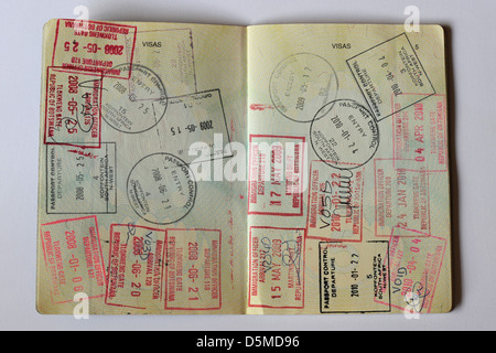 Fully stamped Visa pages in a Passport. Stock Photo